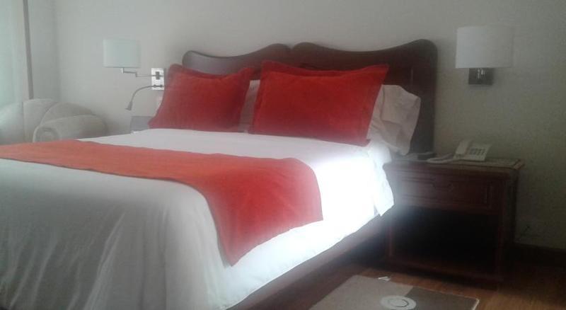 Hotel Santa Lucia Boutique Spa Bogota Ngoại thất bức ảnh A bed with a duvet cover